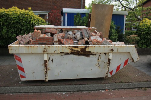 Professional flat clearance team removing furniture in Tooting