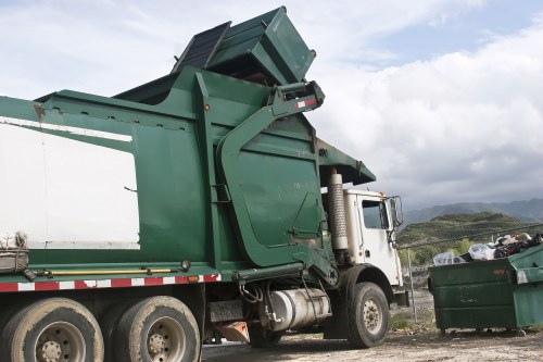 Image depicting local commercial rubbish removal vehicles and crews